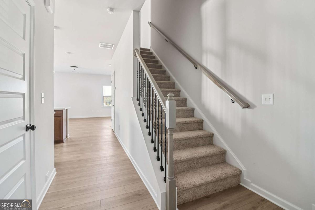 708 Shetland Trail Cartersville, GA 30121 - Photo 4 of 56 a view of a hallway with wooden floor and entryway