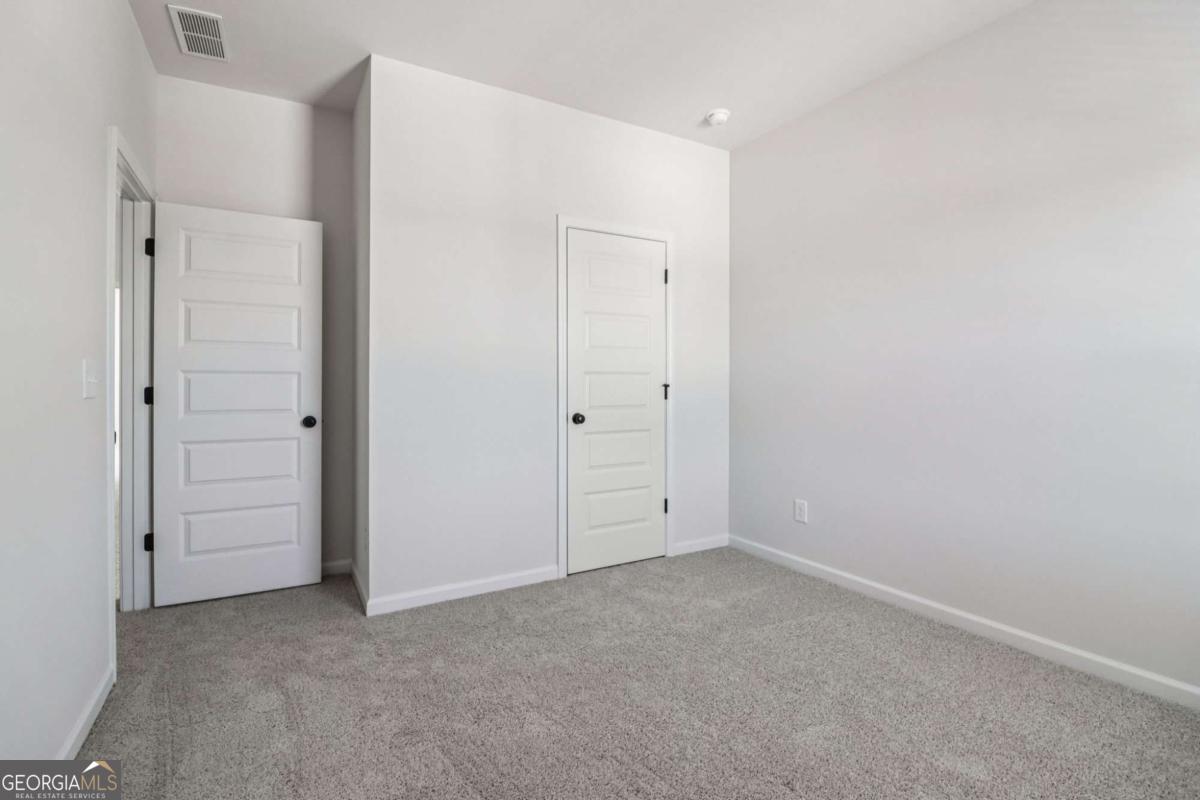 708 Shetland Trail Cartersville, GA 30121 - Photo 47 of 56 an empty room with closet area