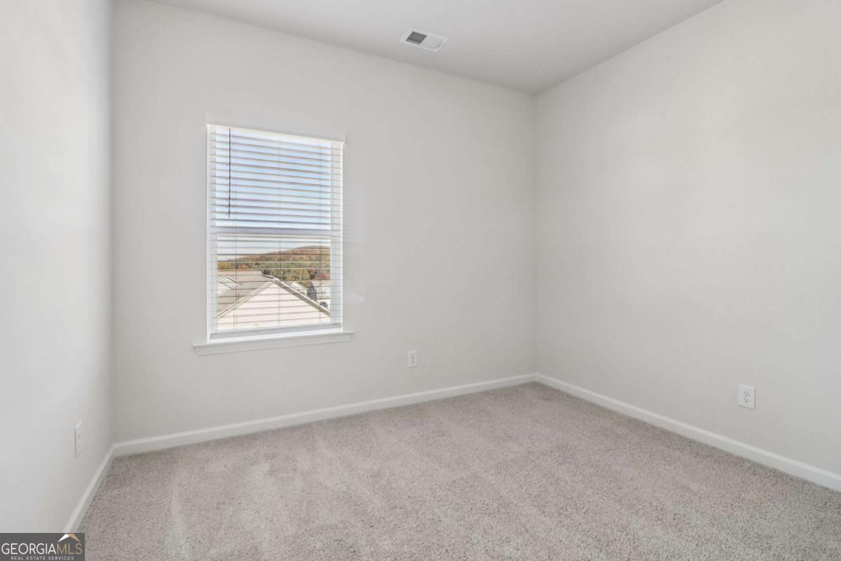 708 Shetland Trail Cartersville, GA 30121 - Photo 49 of 56 an empty room with a window