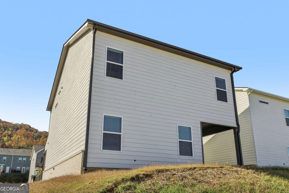 708 Shetland Trail Cartersville, GA 30121 - Photo 54 of 54 a view of a house with a yard