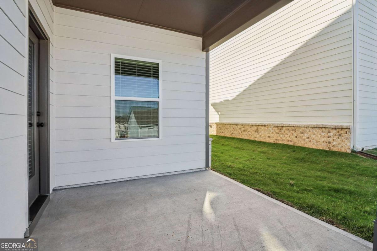 708 Shetland Trail Cartersville, GA 30121 - Photo 55 of 56 a view of a backyard with plants and a bench