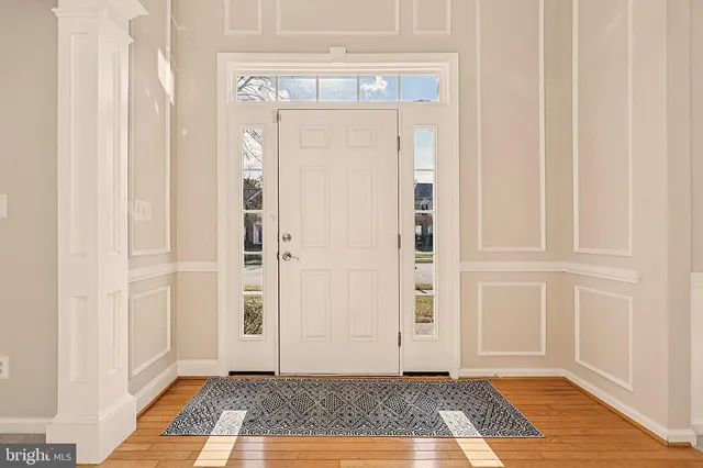 a view of front door with a rug