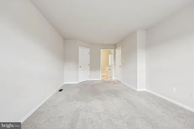 a white bath tub sitting next to a white toilet