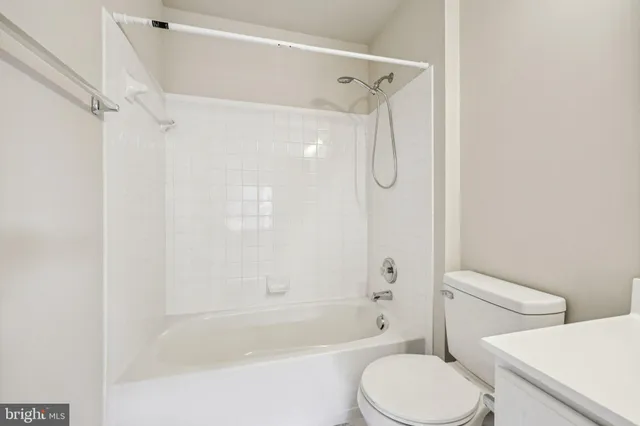 an aerial view of a house with yard