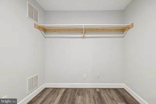 a view of a kitchen with wooden floor