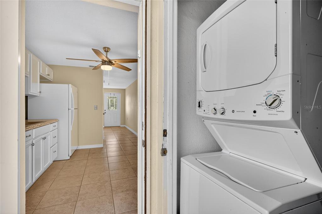 12337 Buffing Road, Unit A AND B Port Charlotte, FL 33981 - Photo 18 of 27 a view of a hallway with wooden floor and staircase