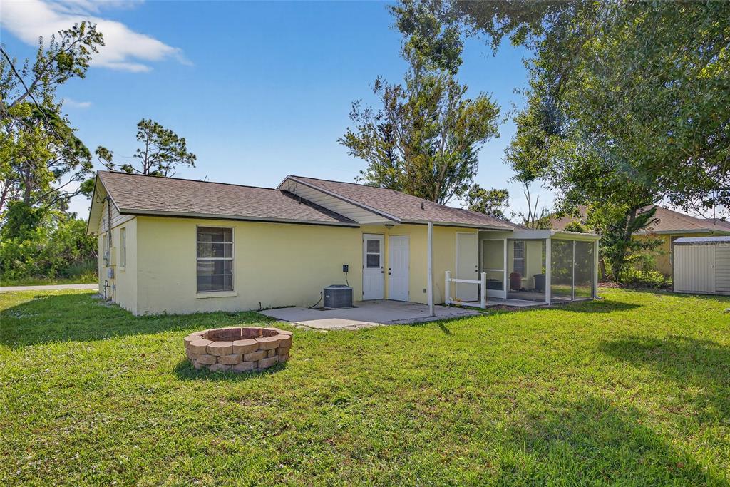 12337 Buffing Road, Unit A AND B Port Charlotte, FL 33981 - Photo 20 of 27 a house view with a sitting space and garden