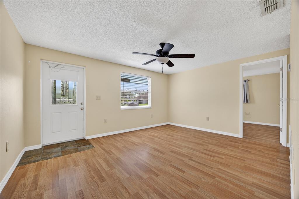 12337 Buffing Road, Unit A AND B Port Charlotte, FL 33981 - Photo 2 of 27 a view of empty room with wooden floor