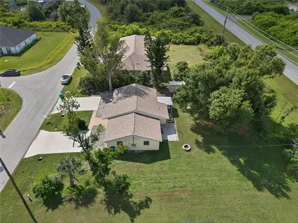 an aerial view of a house with a garden