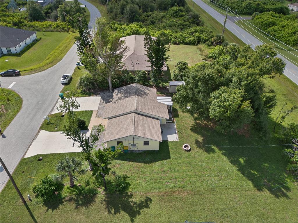 12337 Buffing Road, Unit A AND B Port Charlotte, FL 33981 - Photo 23 of 27 an aerial view of a house with a garden
