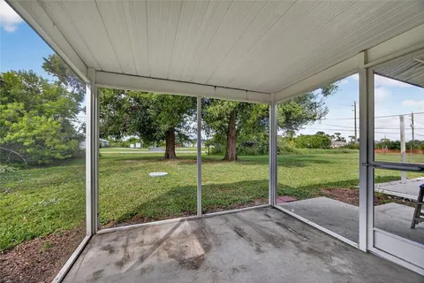 a view of a house with backyard from a balcony