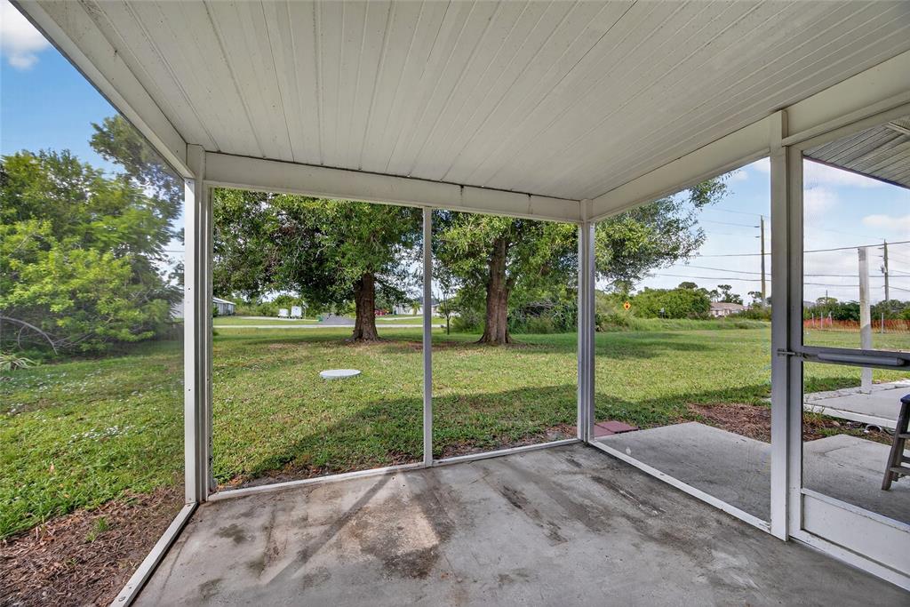 12337 Buffing Road, Unit A AND B Port Charlotte, FL 33981 - Photo 9 of 27 a view of a house with backyard from a balcony