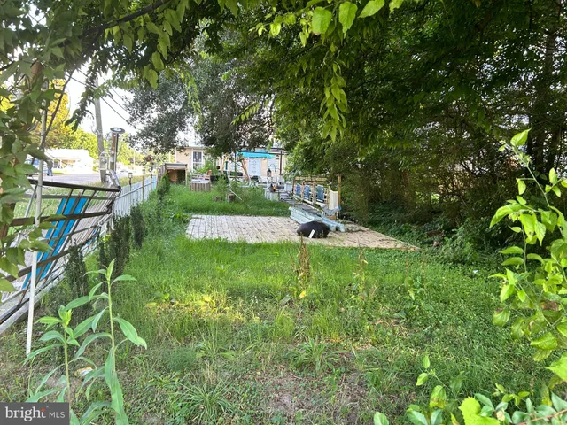 a view of swimming pool is middle in the garden