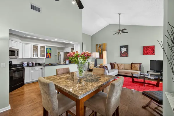 a kitchen with granite countertop a sink and cabinets