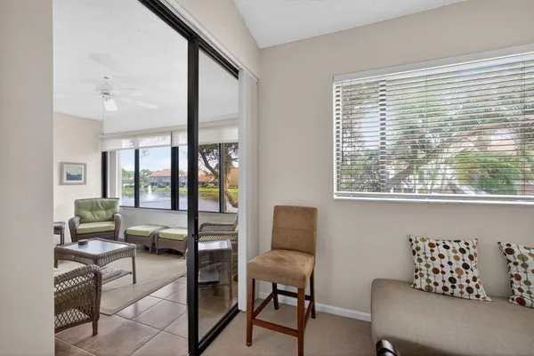 a dining room with furniture a window and wooden floor