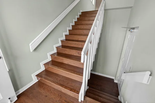a view of a livingroom with furniture and hardwood floor