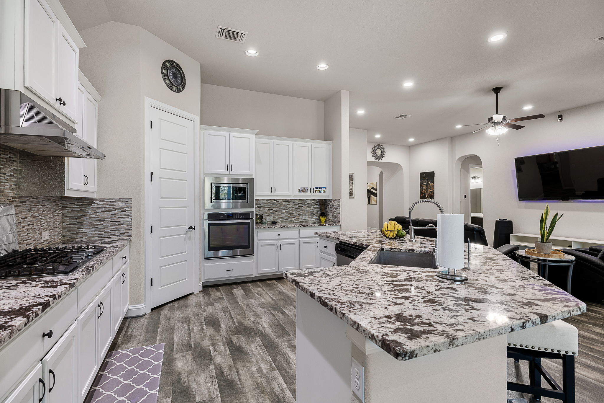 3517 Tree Swallow Way Pflugerville, TX 78660 - Photo 32 of 32 An open floor plan connects the kitchen to the living spaces.