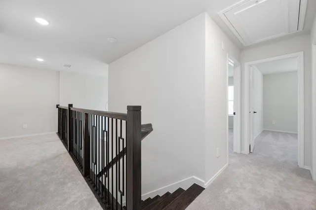 a view of a hallway with windows