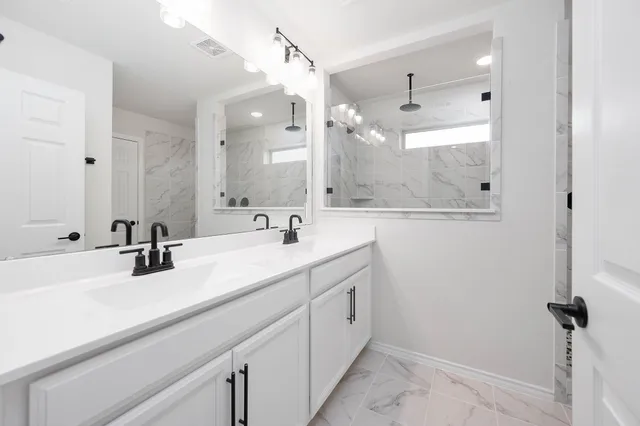 an empty room with windows and closet