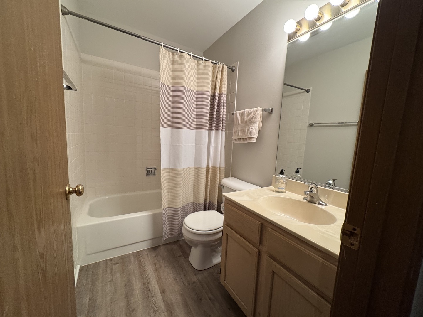 429 Prairieview Drive Oswego, IL 60543 - Photo 17 of 21 a bathroom with a sink a toilet a mirror a vanity and shower