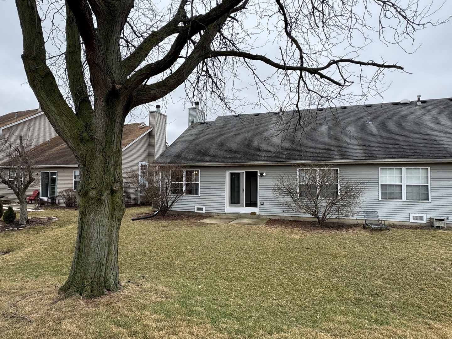 429 Prairieview Drive Oswego, IL 60543 - Photo 21 of 21 a front view of house with yard and trees in the background