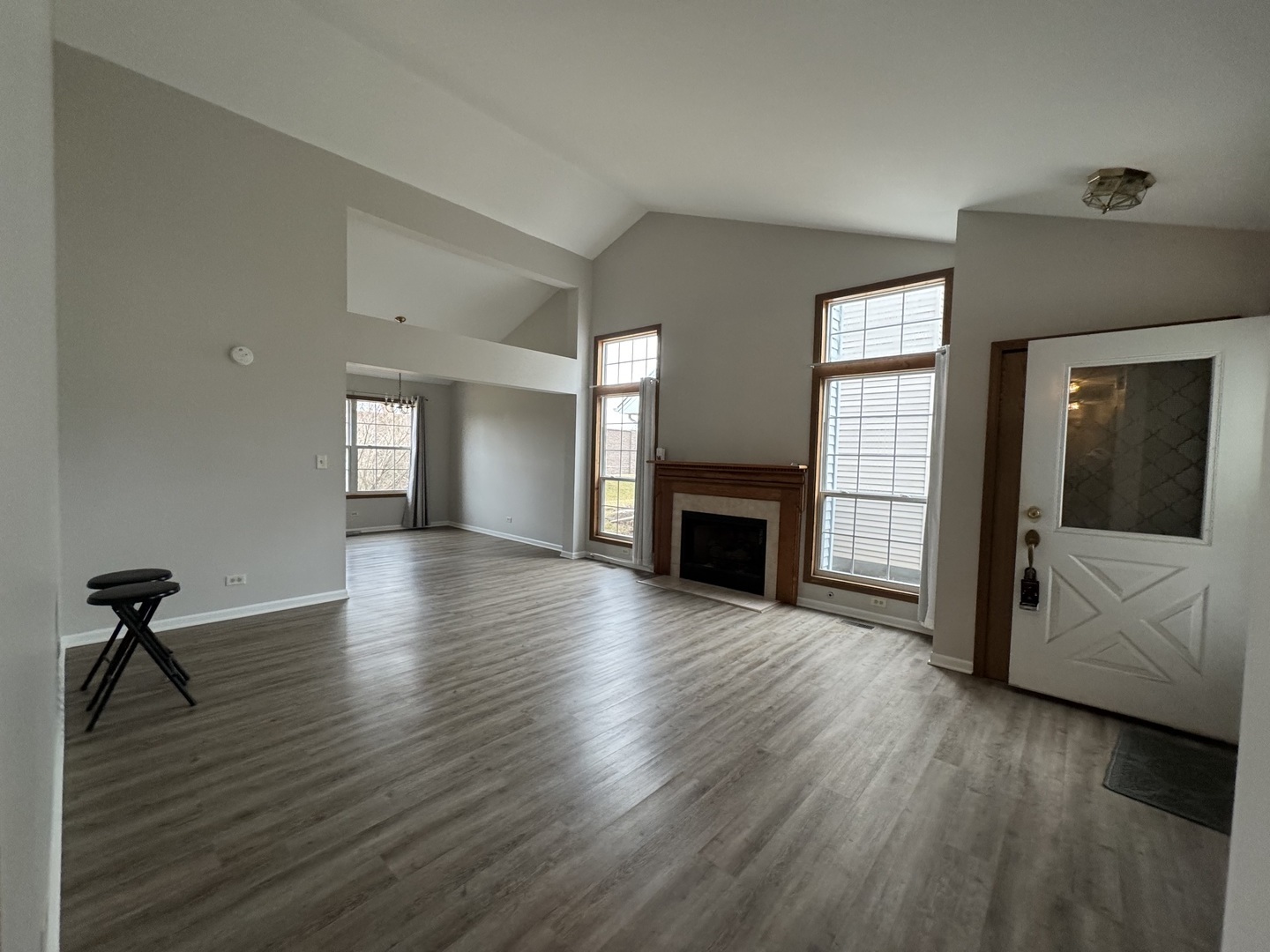 429 Prairieview Drive Oswego, IL 60543 - Photo 4 of 21 a view of an empty room with wooden floor and a window