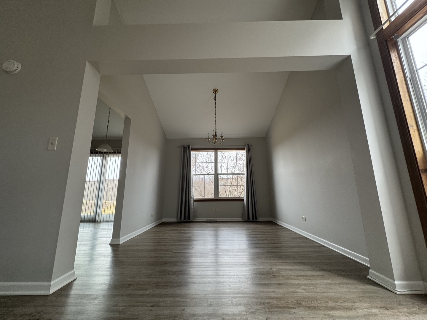 429 Prairieview Drive Oswego, IL 60543 - Photo 5 of 21 an empty room with wooden floor and windows