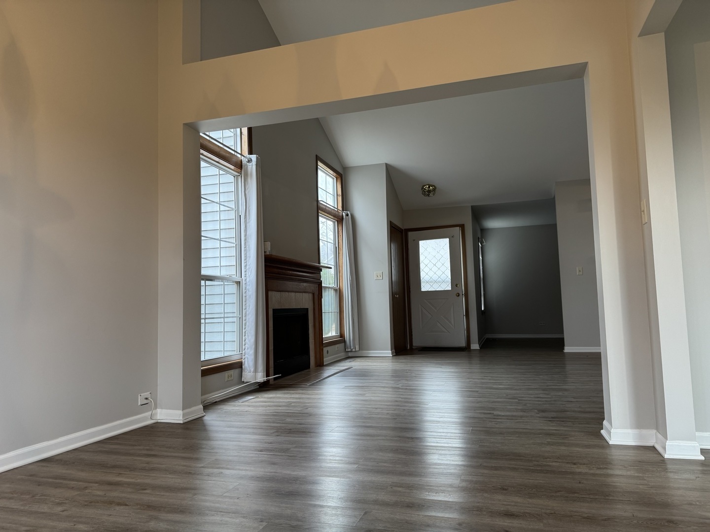 429 Prairieview Drive Oswego, IL 60543 - Photo 6 of 21 a view of a big room with wooden floor and fireplace