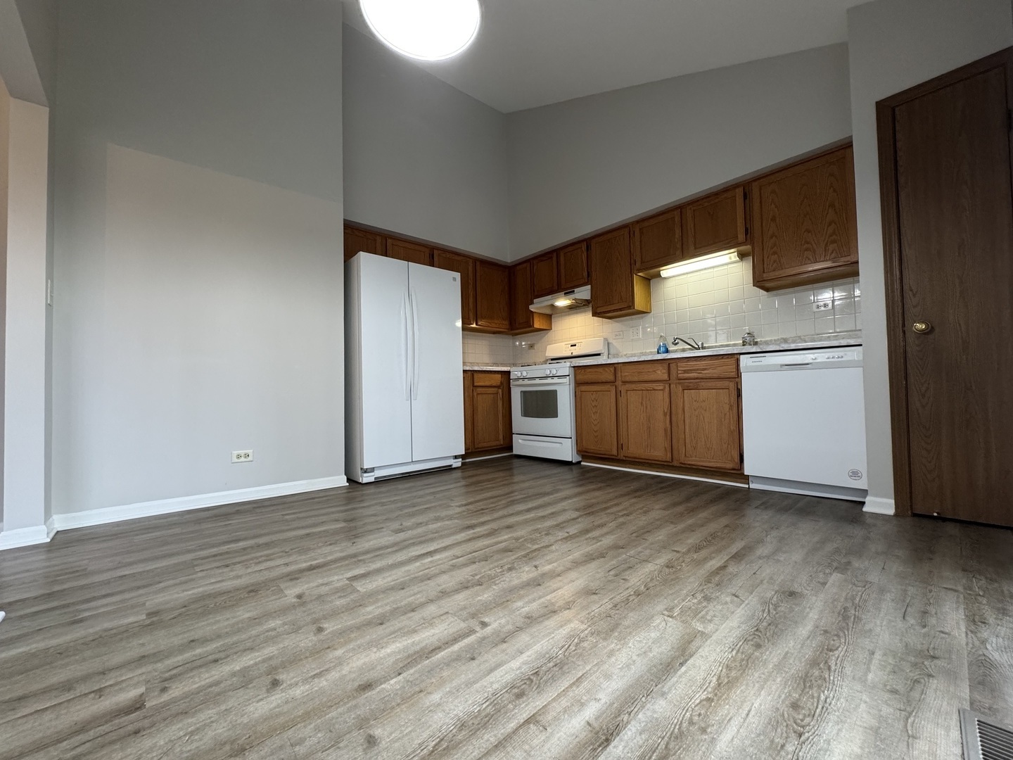 429 Prairieview Drive Oswego, IL 60543 - Photo 7 of 21 a view of kitchen with cabinets and wooden floor