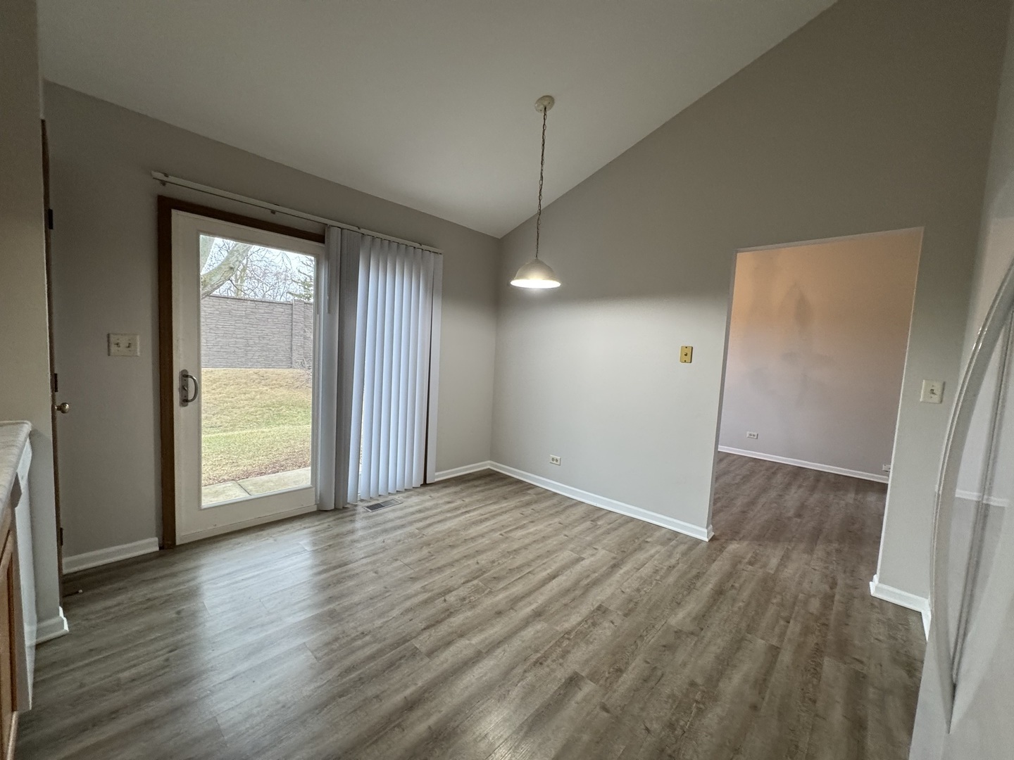429 Prairieview Drive Oswego, IL 60543 - Photo 8 of 21 an empty room with wooden floor and a window
