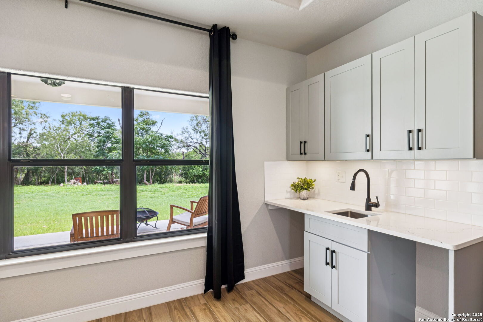 177 East Short Meadow Drive Lytle, TX 78052 - Photo 11 of 63 a kitchen with stainless steel appliances granite countertop a sink and a window