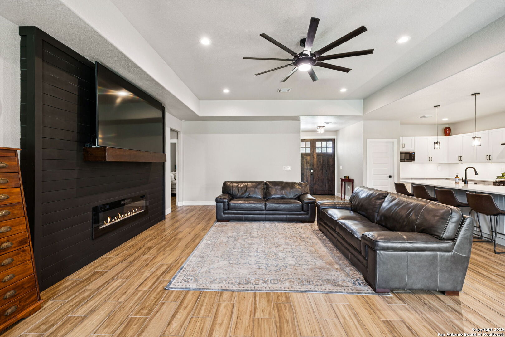 177 East Short Meadow Drive Lytle, TX 78052 - Photo 12 of 63 a living room with furniture and a wooden floor