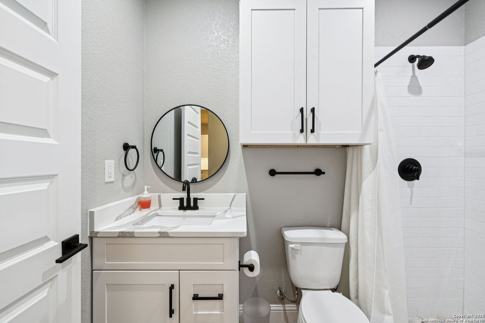 177 East Short Meadow Drive Lytle, TX 78052 - Photo 50 of 63 a bathroom with a toilet sink and mirror