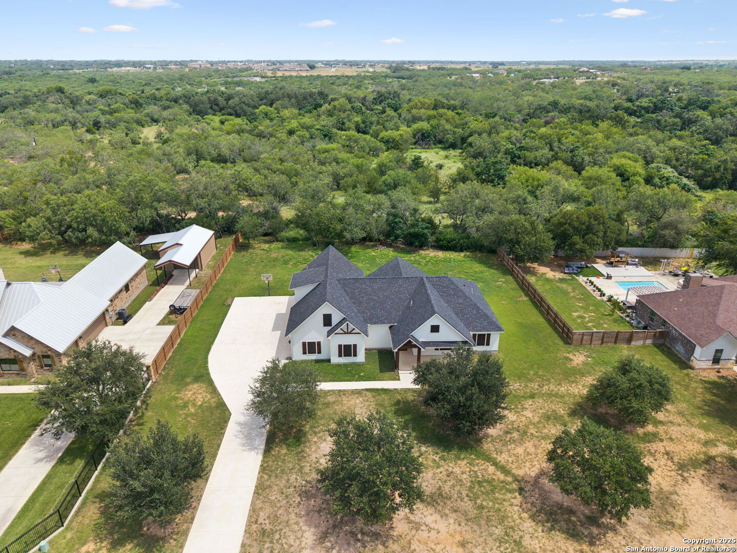 177 East Short Meadow Drive Lytle, TX 78052 - Photo 62 of 63 an aerial view of a house with a garden