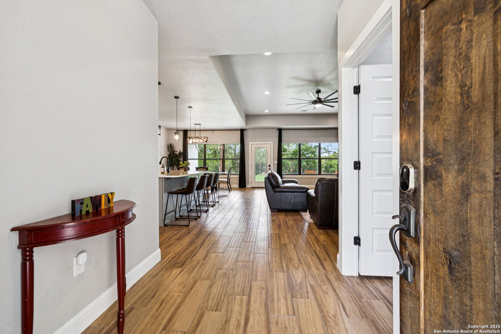 177 East Short Meadow Drive Lytle, TX 78052 - Photo 8 of 63 a living room with furniture and a wooden floor