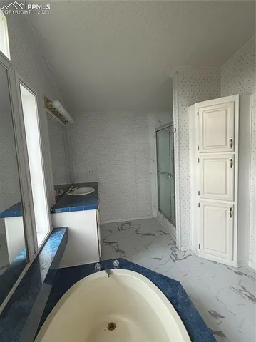a bathroom with a sink and a tub
