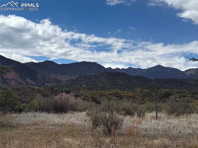 a view of a house with a mountain in the background