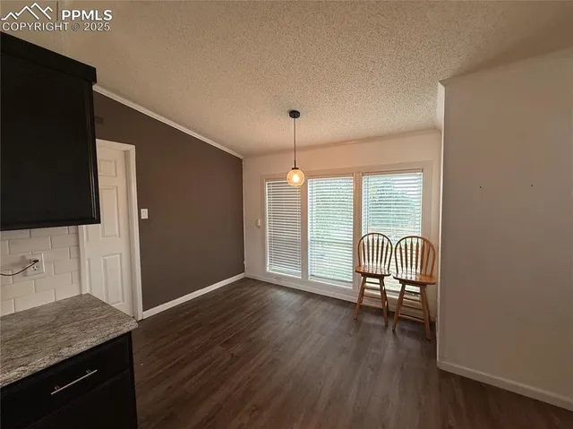 a view of a livingroom with furniture and wooden floor