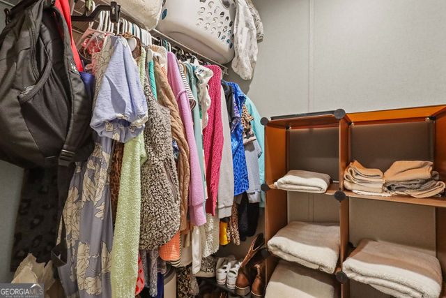 223 Primrose Lane Baxley, GA 31513 - Photo 15 of 27 a view of walk in closet with clothes and shoes