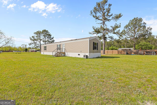 223 Primrose Lane Baxley, GA 31513 - Photo 21 of 27 a view of a house with an ocean view