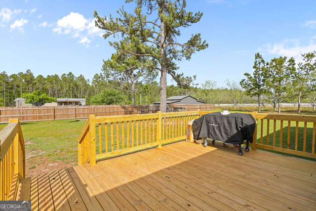 223 Primrose Lane Baxley, GA 31513 - Photo 26 of 27 a view of a swimming pool with a lounge chair