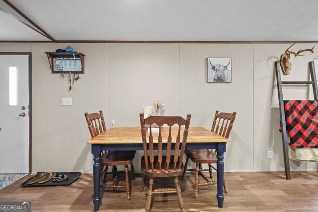 223 Primrose Lane Baxley, GA 31513 - Photo 7 of 27 a view of a dining room with furniture