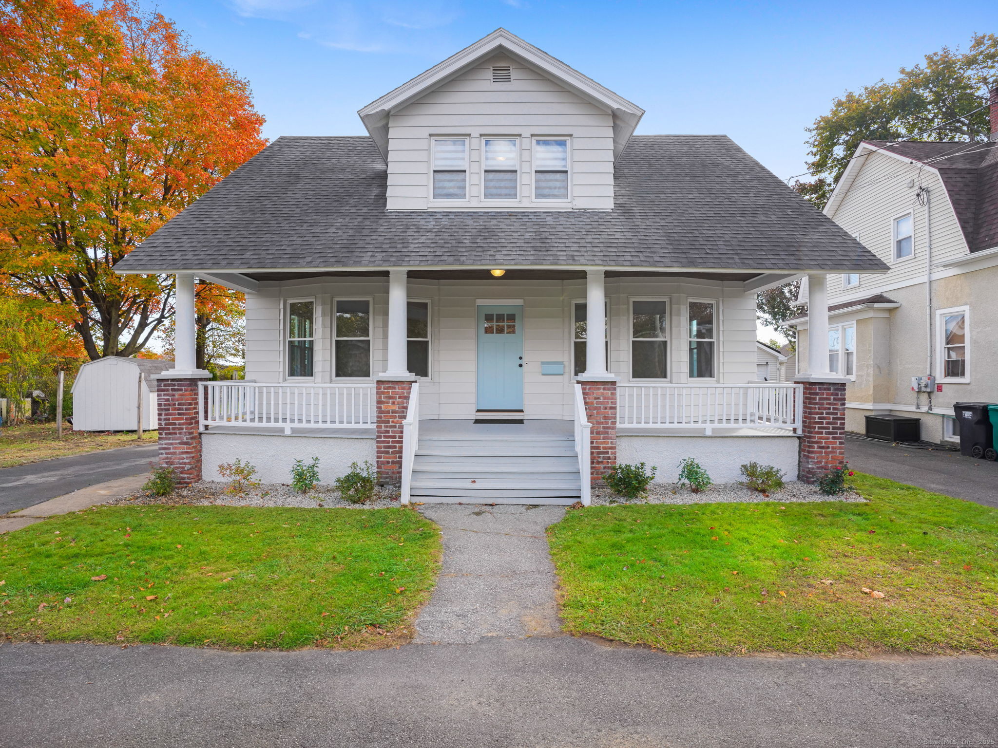 a front view of house with yard and green space