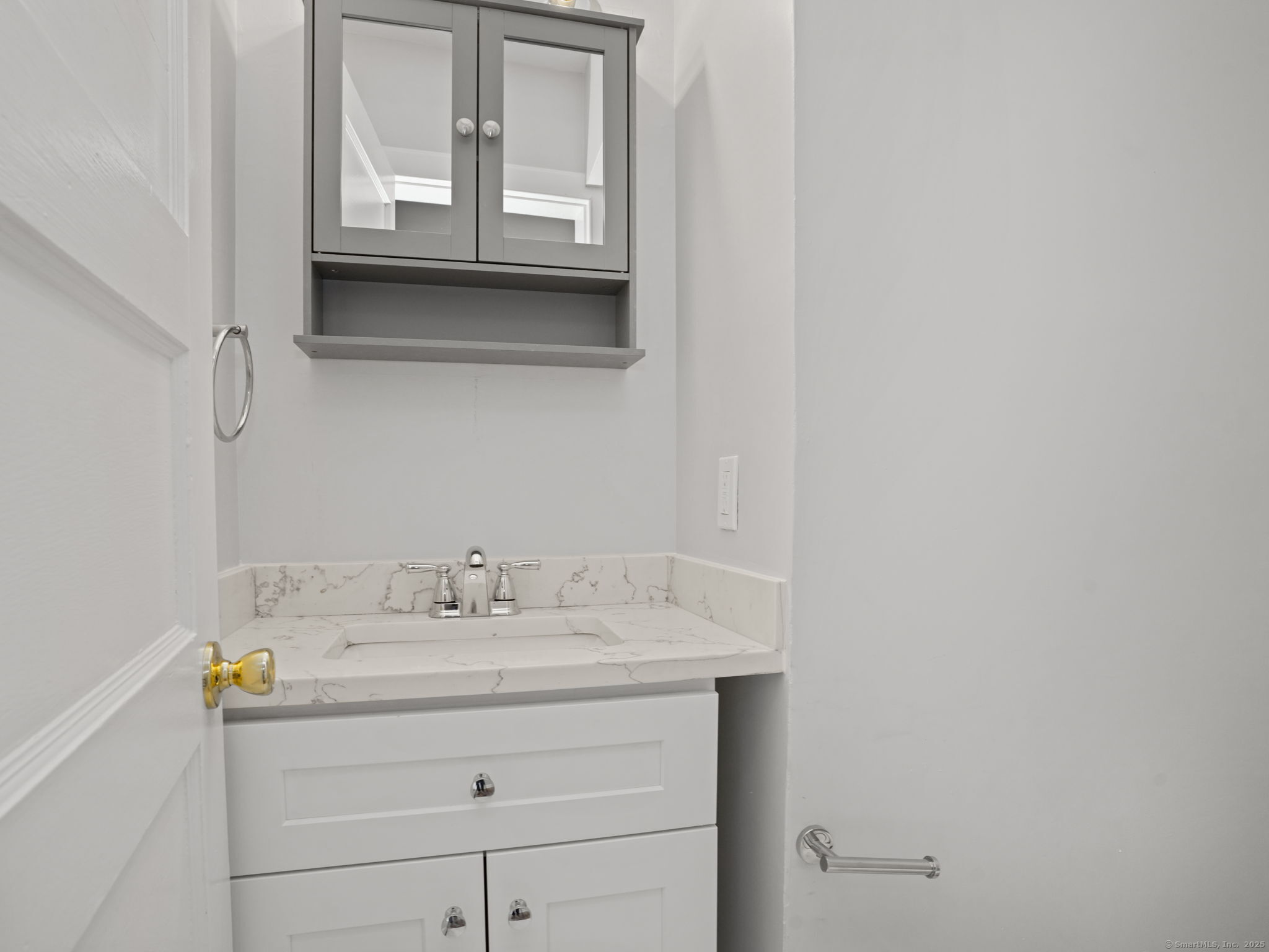 29 Redfield Road Fairfield, CT 06824 - Photo 12 of 37 a bathroom with a sink and a mirror