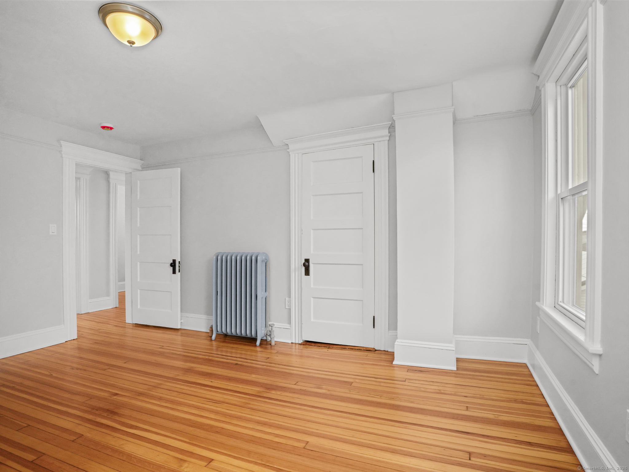 29 Redfield Road Fairfield, CT 06824 - Photo 22 of 37 a view of empty room with wooden floor