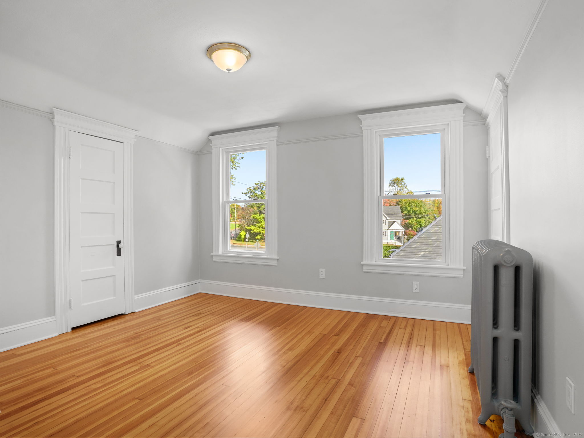 29 Redfield Road Fairfield, CT 06824 - Photo 24 of 37 an empty room with window and wooden floor