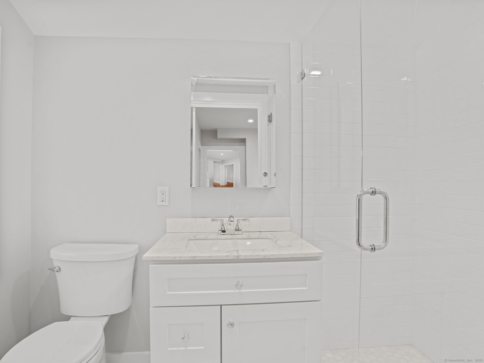 29 Redfield Road Fairfield, CT 06824 - Photo 5 of 37 a bathroom with a toilet sink shower and mirror