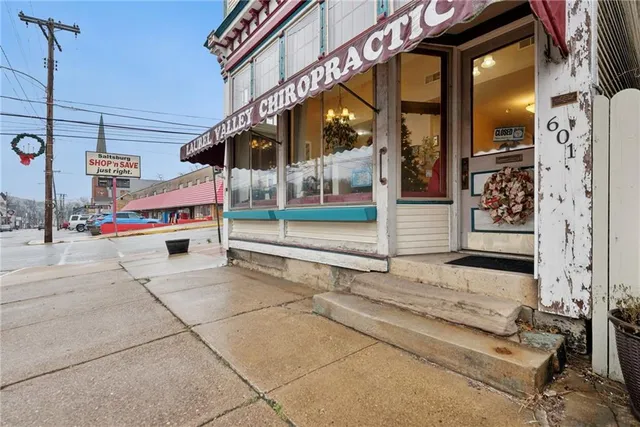 a yellow building with sign broad