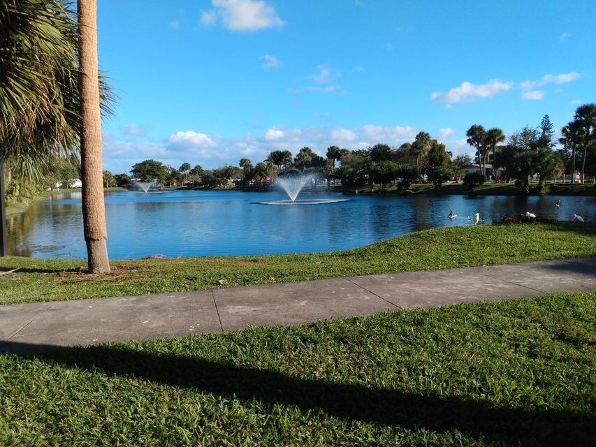 225 Bonnie Boulevard, Unit 109 Palm Springs, FL 33461 - Photo 5 of 5 an aerial view of a yard with a lake view