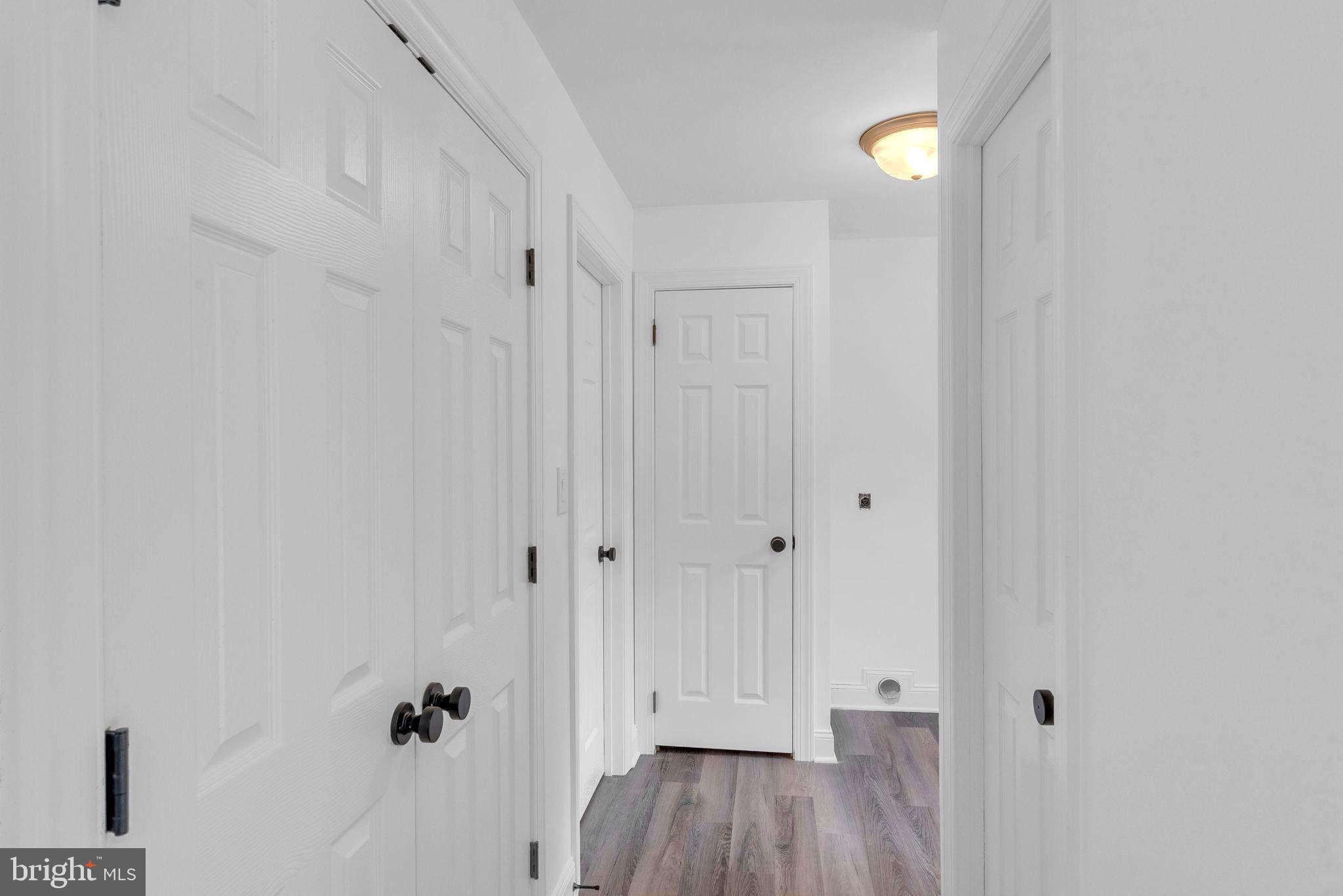 5925 Corrigan Road Doylestown, PA 18902 - Photo 11 of 64 a view of a hallway with wooden floor